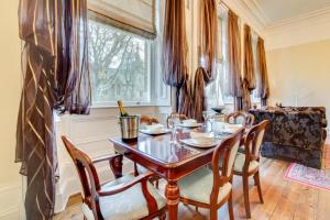 a dining room with a wooden table and chairs at 2 Bed in Beadnell oc-gd1869 in Beadnell