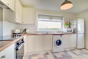 a kitchen with a washer and dryer in it at 2 Bed in Berwick-upon-Tweed oc-gd1871 in Ancroft