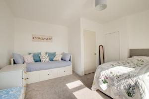 a white bedroom with a bed and a bedside table at 2 Bed in Berwick-upon-Tweed oc-gd1871 in Ancroft