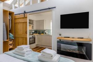 a room with a kitchen with a tv and some towels at 1 Bed in Cerrigydrudion oc-bow194 in Cerrig-y-Druidion +16 photos