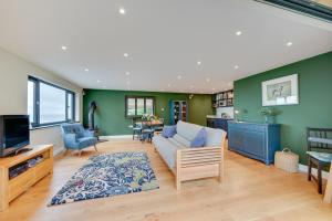 a living room with a couch and a tv at 5 Bed in Woolacombe oc-alba12 in Woolacombe