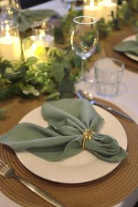 a plate with a green bow on a table at Wawee Sunset, Doi Chang Chiang Rai in Ban Huai Khai