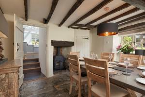 a dining room with a table and a fireplace at 3 Bed in Dalwood oc-p27362 in Dalwood