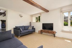 a living room with a couch and a flat screen tv at 3 Bed in Dalwood oc-p27362 in Dalwood