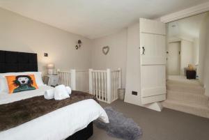 a bedroom with a large bed and a bathroom at 3 Bed in Dalwood oc-p27362 in Dalwood