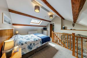 a bedroom with a bed and a balcony at 1 Bed in Dyffryn Ardudwy oc-g29349 in Dyffryn