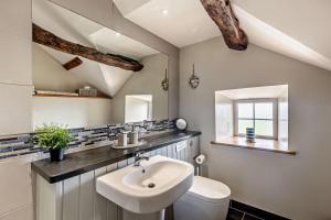 a bathroom with a sink and a toilet at 1 Bed in Dyffryn Ardudwy oc-g29349 in Dyffryn +24 photos
