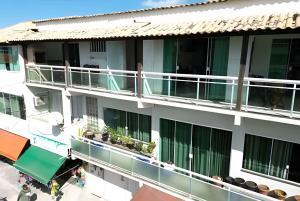an overhead view of a building with balconies at Central Praias Suíte 202 com ar, tv, frigobar, banheiro privativo, espaçosa em frente à praça in Cabo Frio