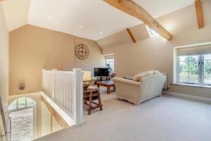 a living room with a couch and a chair at 2 Bed in Oxborough oc-t29292 in Oxborough