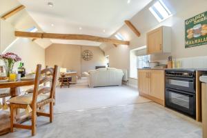 a kitchen and living room with a table and chairs at 2 Bed in Oxborough oc-t29292 in Oxborough