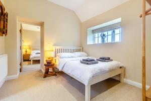 a bedroom with a bed with towels on it at 2 Bed in Oxborough oc-t29292 in Oxborough