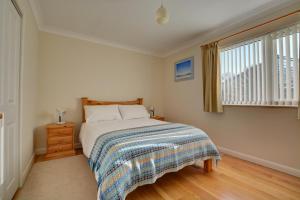 a bedroom with a bed and a window at 2 Bed in Attleborough oc-1277 in Old Buckenham