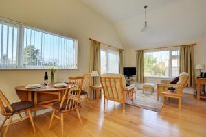 a living room with a table and chairs at 2 Bed in Attleborough oc-1277 in Old Buckenham