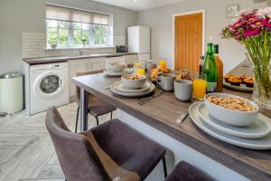 a kitchen with a table with food on it at 2 Bed in Oxborough oc-r29290 in Oxborough