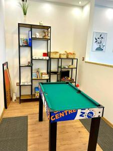 a billiard table in a room with a shelf at VestaLak in Tata