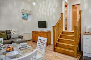 a living room with a dining table and a television at 2 Bed in Shotley Bridge oc-h29037 in Shotley Bridge