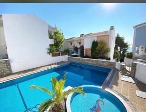 a swimming pool in the backyard of a villa at Infinity View Villa Panoramic Aegean Siviri in Siviri