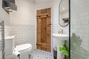 a bathroom with a toilet and a sink at 3 Bed in Appledore oc-f29064 in Appledore +19 photos