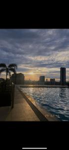a view of a swimming pool in a city at A&R Haven in Manila