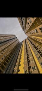 a view of a tall building from the ground at A&R Haven in Manila