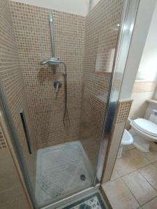 a shower in a bathroom with a toilet at Mira Beach Casa Vacanze in Praia a Mare +40 photos