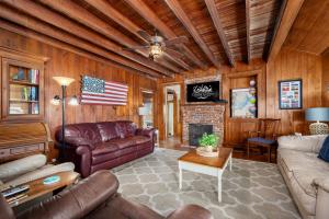 a living room with a couch and a fireplace at NH330 It's Beach Time in Nags Head