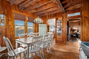 a dining room with a table and chairs at NH330 It's Beach Time in Nags Head
