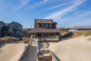 a house on the beach in the sand at NH330 It's Beach Time in Nags Head