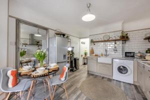 a kitchen with a table and chairs in a room at 2 Bed in Horns Cross oc-l29271 in Bucks Mills