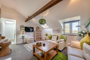 a living room with a couch and a table at 2 Bed in Horns Cross oc-l29271 in Bucks Mills