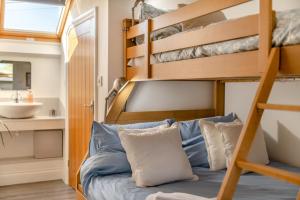 a bunk bed in a tiny house with a sink at 2 Bed in Horns Cross oc-l29271 in Bucks Mills
