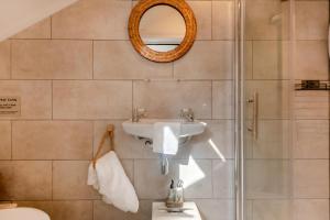 a bathroom with a sink and a mirror at 2 Bed in Horns Cross oc-l29271 in Bucks Mills +16 photos