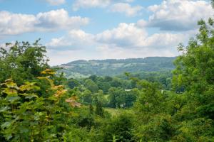 a view of a valley with trees and mountains at 1 Bed in Ashover oc-dclhil in Ashover +3 photos