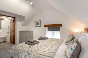 a bedroom with a bed with two pillows on it at 1 Bed in Ashover oc-dclhil in Ashover