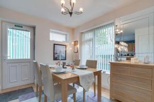 a kitchen and dining room with a table and chairs at 1 Bed in Belford oc-nb677 in Belford