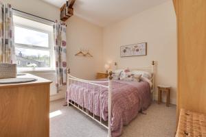 a bedroom with a bed and a window at 3 Bed in Bainbridge oc-ds1026 in Bainbridge