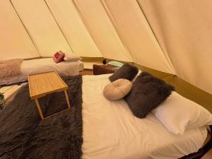 a room with two beds in a tent at Dovedale in Ashbourne +3 photos