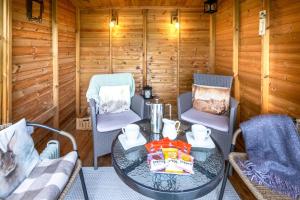 a room with a table and chairs in a cabin at 2 Bed in Low Row oc-ds059 in Feetham