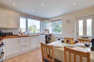 a kitchen with a table with a bowl of fruit on it at 2 Bed in Hawes oc-ds052 in Hawes +11 photos