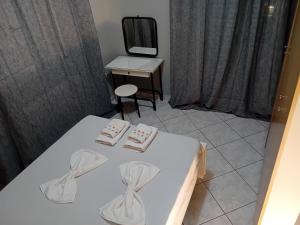 a room with a bed and a mirror and a table at White Villa in Xylokastro +53 photos