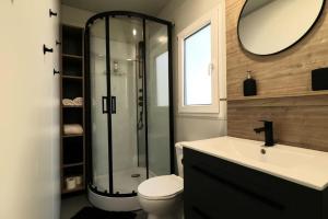 a bathroom with a shower and a toilet and a sink at MobileHome Serdar in Sveti Filip i Jakov +43 photos