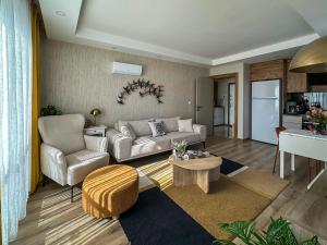 a living room with a couch and a table at Chic 2BR City Center Flat in Antalya +57 photos