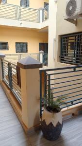 a balcony of a house with a plant at LEYLA house Résidence haut Standing in Bamako