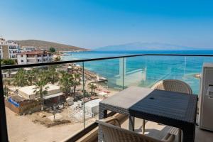 a balcony with a view of the ocean at Mirage Bay Deluxe in Sarandë