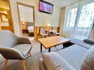 Un televizor și/sau centru de divertisment la Hotel Čingov Slovenský raj