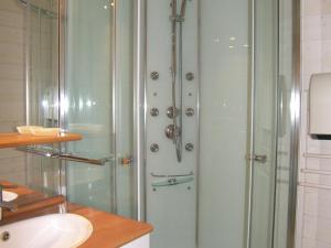 a glass shower in a bathroom with a sink at Scenic Apartment near Ski Area in Meribel in Méribel