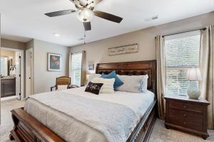 a bedroom with a bed and a ceiling fan at Gateway to Fort Campbell! Home w/ Furnished Deck in Clarksville