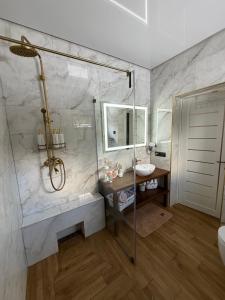 a bathroom with a shower and a sink at Luxury Home in Slavske +25 photos