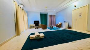 a room with a bed in the middle of a room at WELCOME LODGE in Ouagadougou +147 photos