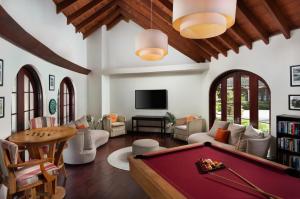 a living room with a pool table at Mango Bay All Inclusive in Saint James